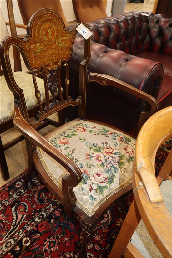 A late Victorian marquetry inlaid elbow chair